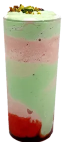 Layered pastel smoothie in a clear cup with pink, green, and red layers, topped with whipped cream and a fruit garnish.