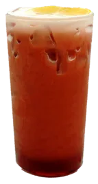 Tall glass of iced coffee with ice cubes and a thin layer of foam on top.